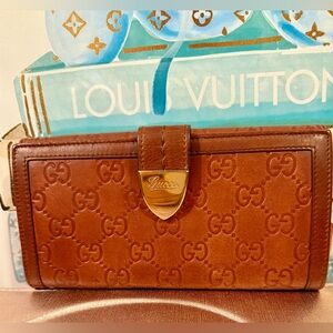 Gucci long buckle wallet. Cognac colored leather with gold hardware.